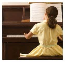 child with hobby playing piano